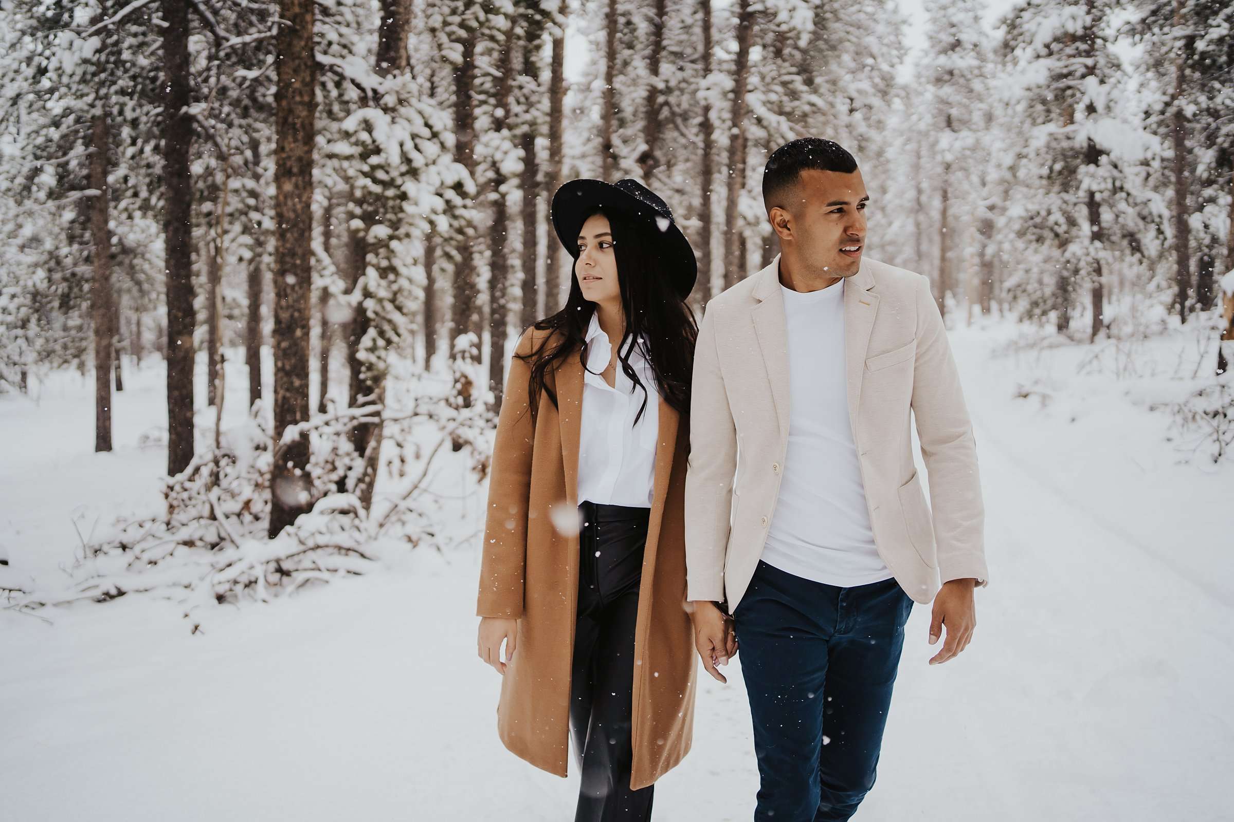couple walking in snow in colorado