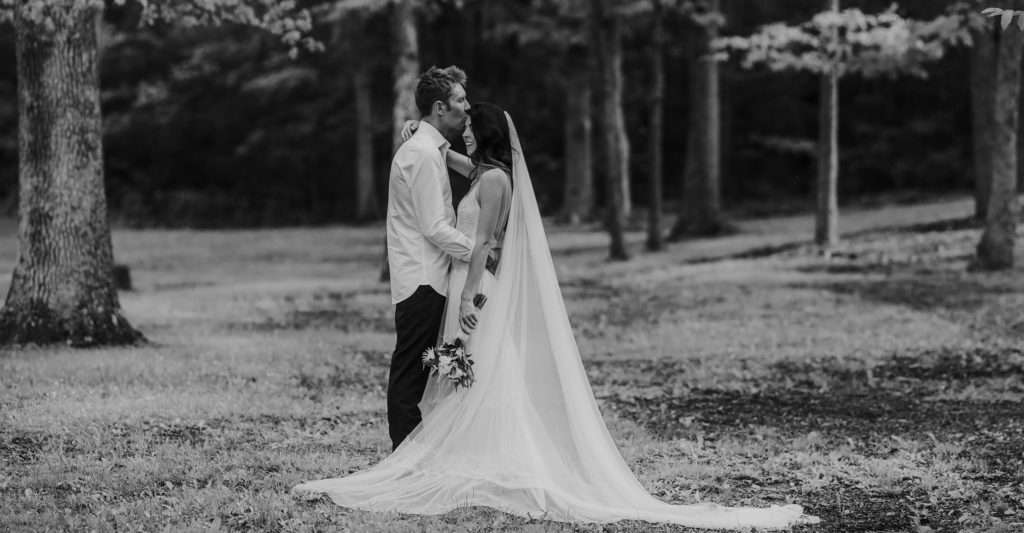 bride and groom at elopement in the woods
