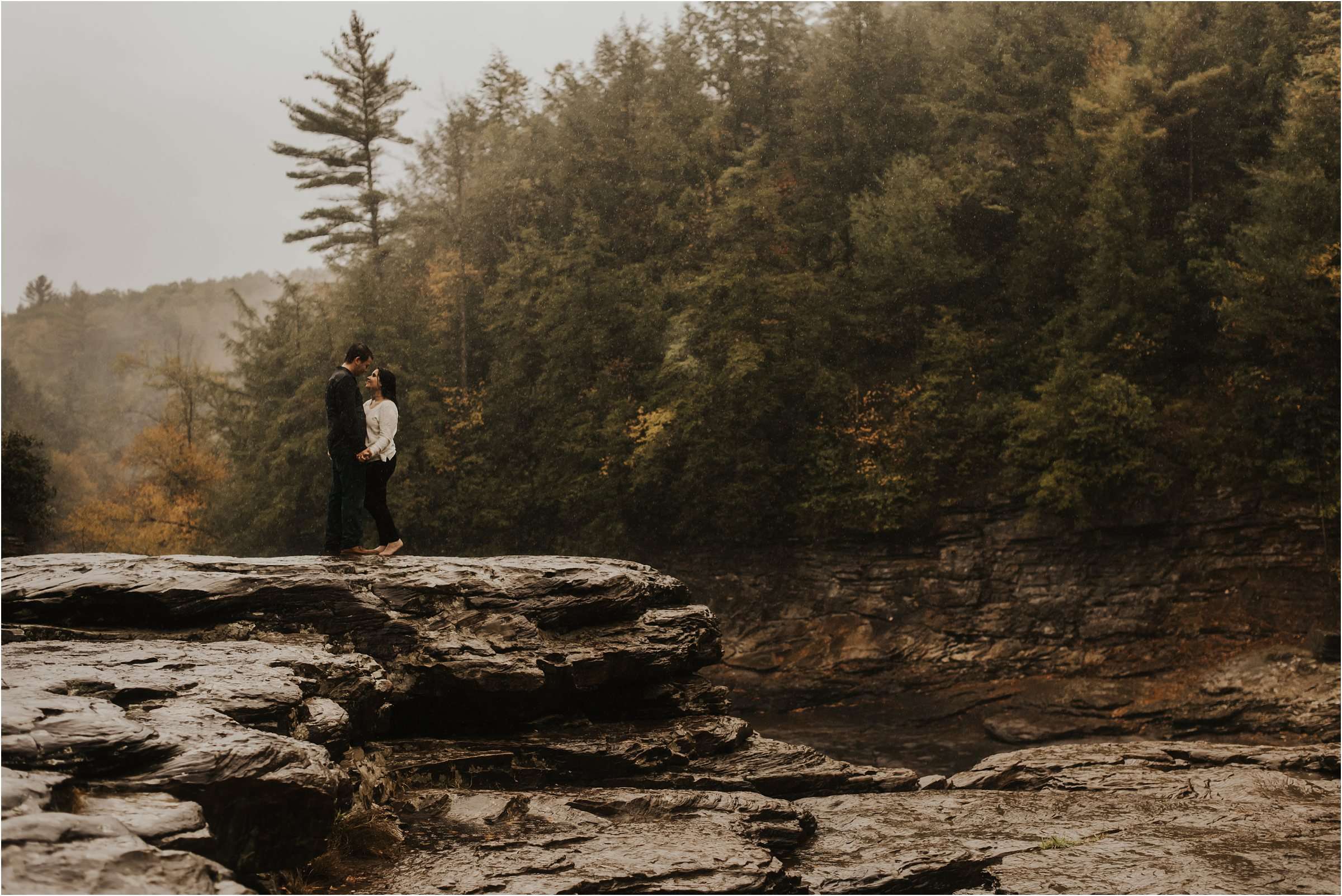 engaged couple on mountains with waterfalls