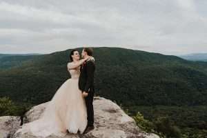wedding couple hugging on west virginia mountain near blackwater falls